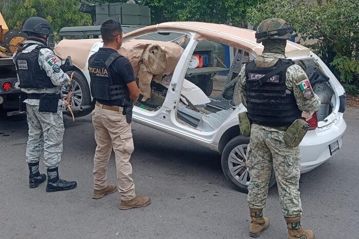 Autoridades desmantelan taller para blindar vehículos al Cártel de Tepalcatepec; aseguran 4 autos robados